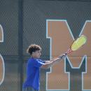 Thomas DeCanto hits it back to his opponent. 