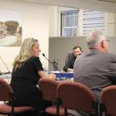 Jennifer McHugh sits next to Christian Consoletti during the meeting. 