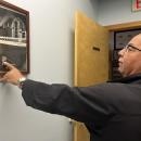 Every day on his way in to work Rogers can catch glimpses of his legacy with photos of his uncle and father.