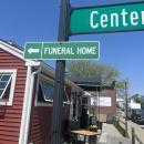 A sign in front of the Pour Farm Tavern points to the Wareham Village Funeral Home. Photos by Brandy Muz