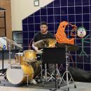 The high school band invited alumni, like Malachi Samuels who graduated in 2024, to play with them.