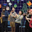 Wareham alumna Sophia Maniglia, center, performs with other students and music teacher Jason Roth, to her left. Photos by Nick Mossman