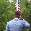 Onset VFW Post commander Benjamin Baptise salutes the flag.
