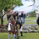 The minutemen fire their rifles.