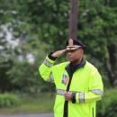 Wareham Police Chief Walter Correia salutes during the playing of Taps.