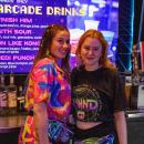 Olivia Vaccaro and Lily Shepley working donned in 80's gear.