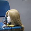 One of the show's many wigs sitting on a mannequin at rehearsal.