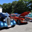 Cars with hoods open