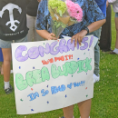 A sign supporting a graduate. 