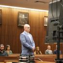 Selectman Jared Chadwick stands in a courtroom on Thursday, July 9, before separate charges from earlier this year were dismissed. Photo by Nick Mossman