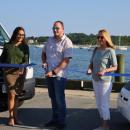 From left to right: Thandi Nyambose, John Faherty and Sarah Corbitt cut the ribbon on the Circuit shuttle. Photos by Nick Mossman
