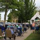 Residents pack the lawn outside the library for the concert.