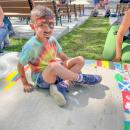 Tommy McGrath, 6, painted flags of all the countries in the World Cup, his favorite event of the summer. Photo by Christian Uva