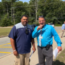 Coach Stephen Faniel and Principal Scott Palladino see off kids after the first day of school. Photo by Christian Uva