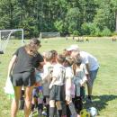 A team huddles after winning its first game of the year.