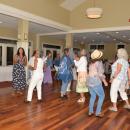 Classmates dance together.