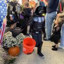 Darth Vader makes his way down the sidewalk. 