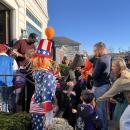 Trick or treaters stream out of a law office on Main Street. 