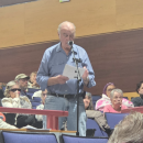 Howard Smith speaks against the petition to change zoning bylaws at the Oct. 26 Town Meeting. Photo by Tanvi Kulkarni