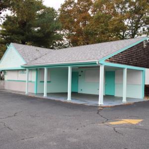 The iconic turquoise building sits empty.