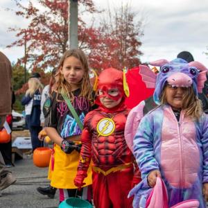From left: Nora, 7, Lucas, 4, and Elise, 4, were some of the last trunk-or-treaters to head home. none