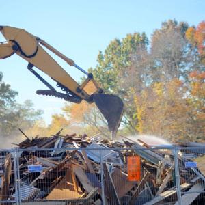The demo took down the two-story home. Photo by Brandy Muz The demo took down the two-story home. Photo by Brandy Muz