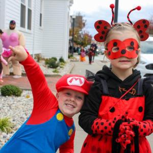 Clayton and Genevieve Schmoker gather candy in style.