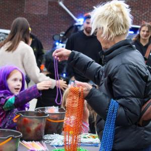 The Wareham Village Association hands out beads.