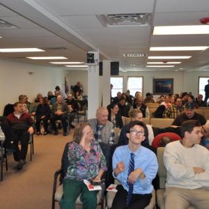 Members gather inside for the first time.