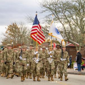 The American Flag stands tall as the Wareham JROTC marches forward.
