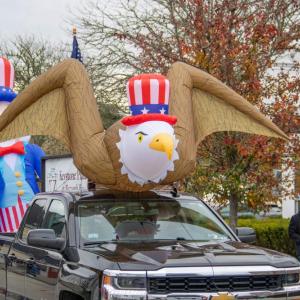 The bald eagle floats through the parade. 
