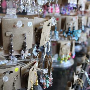 Handmade jewelry at one table. 