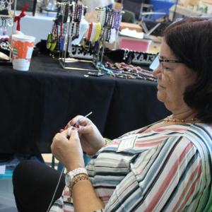 One booth works on future sale items during the fair.
