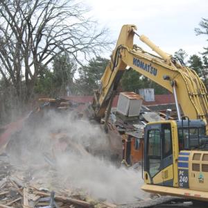 Dust settles on the tear down.