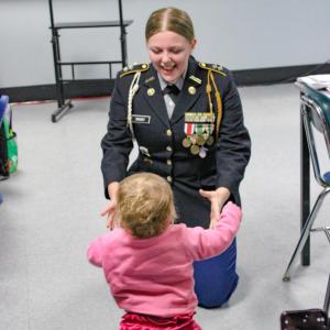 Small steps by Ava's little sister following the ceremony.