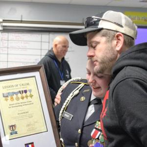 Christopher Knight hugs his daughter.