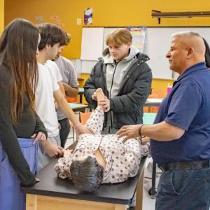 Students practiced real life situations with a dummy.