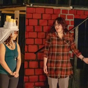 Brianna Gabrey as Christmas Past and Lilyan Medina as Scrooge.