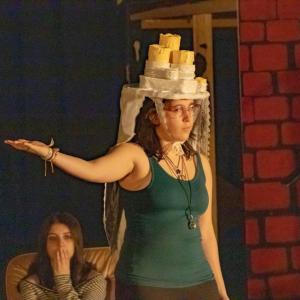 Christmas Past gestures to memories of Scrooge being cruel.