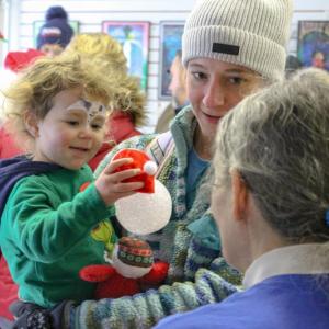 Morgan Sousa gets a new ornament. Photos by Brandy Muz