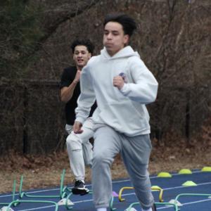Practing alongside his teammates Owen Dillen runs. 