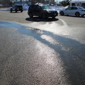 Water trickling onto Onset Avenue. 