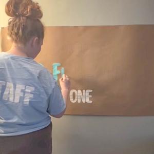 Hallahan creating one of her banners.