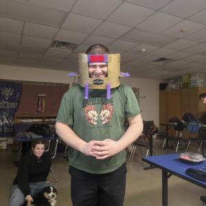 Students test out the Dr. Doom mask made from the tech team. 