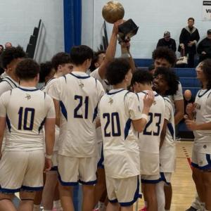 The team celebrates with their trophy. Photos source: Wareham High School