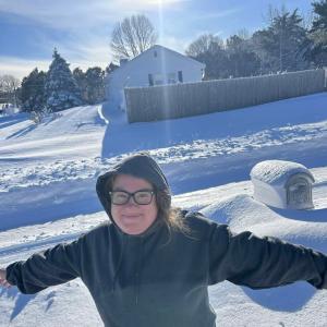 Tara Jones embracing the snow. Photo source: Tara Jones