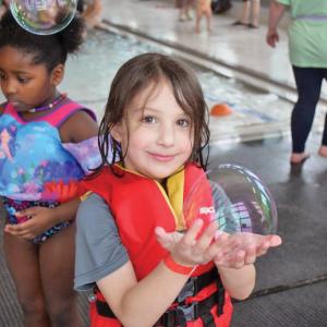 Jackson, 5, holds a bubble he caught.