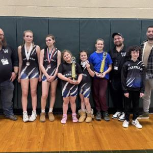 The team with their coaches. 