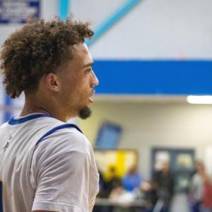 Amare Rose looks down court. 