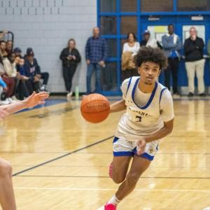 Malikhi Tavares drives the ball down court. 